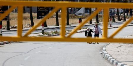 بلدة بالضفة الغربية تتحول "لسجن كبير" بعد أن أحاطها الاحتلال بسياج - بوابة اخر ساعة